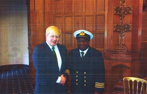 Facilities management in London, Direct Costs Cutters founder Seton During posing next to Boris Johnson.